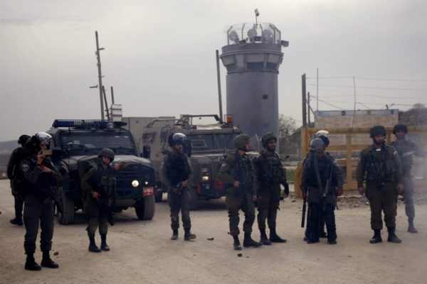 Israeli forces stand at one of the entrances to Israel's Offer prison on December 28, 2016