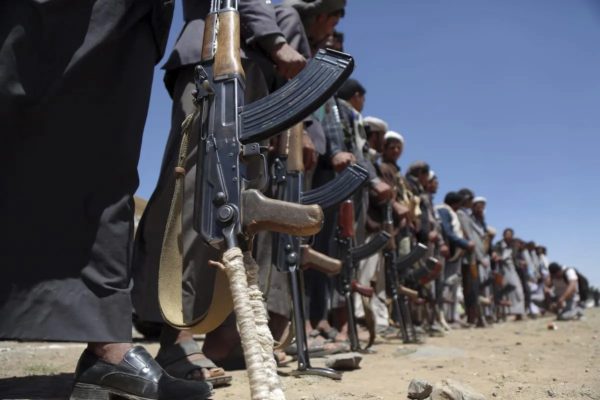 Houthis holding guns in Sana'a, Yemen