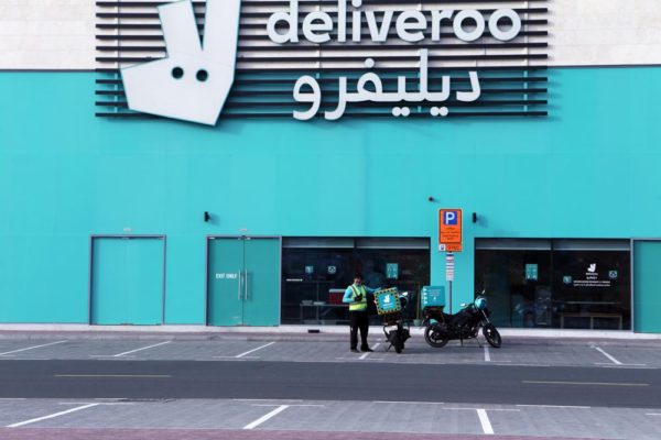 A food-delivery worker enters one of Deliveroo's delivery-only kitchens in Dubai, United Arab Emirates, May 2, 2022. Food-delivery drivers protesting wage cuts and grueling working conditions went on an extremely rare strike in Dubai on Saturday, April 30, 2022 — a mass walkout that paralyzed one of the country’s main delivery apps and revived concerns about labor conditions in the emirate. The strike ended early Monday, when London-based Deliveroo agreed to restore workers’ pay to $2.79 per delivery instead of the proposed rate of $2.38 amid surging fuel prices