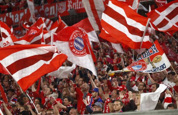 Bayern Fans wave flags at a match between FC Bayern Munich and Real Madrid, April 2018