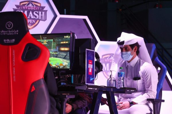 Esport athletes compete during Virtuocity Smash Open 2022 at the Doha Festival City in the Qatari capital on March 17, 2022 [KARIM JAAFAR/AFP via Getty Images]